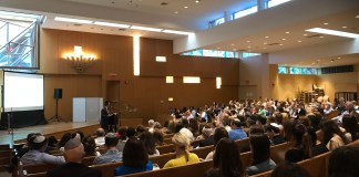 A crowd of parents, Holocaust survivors, and school staff attended a showing of a student-produced documentary telling the stories of Holocaust survivors. (Photo courtesy of Abby Weiss)