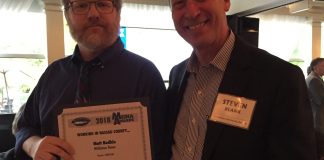 Editor and publisher Steve Blank poses for a photo with Matt Bodkin, who won third place for best editorial cartoon. (Photo courtesy of Steve Blank)