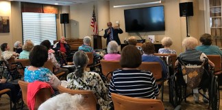 Assemblyman Anthony D’Urso addresses the audience in the Atria Cuttermill’s Community Room. (Photo courtesy of Assemblyman Anthony D'Urso's office)