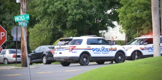 Police block off the route to North Road, where police say a woman was stabbed. Her death is being investigated by the Homicide Squad. (Photo by Janelle Clausen)