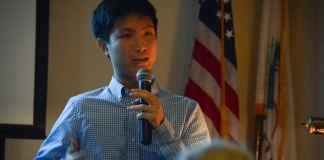 Raymond Lin answers questions from attendees at the Great Neck House about his and Abizadeh's research. (Photo by Janelle Clausen)