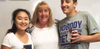 Award winners Annie Park and Spencer Horowitz of South High School are congratulated by American Sign Language teacher Kathy McAleer. (Photo courtesy of the Great Neck Public Schools)