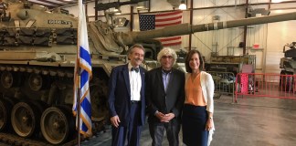 Legislator Ellen Birnbaum, Yuval Neria, and Rabbi Harvey Abramowitz commemorate the 45th anniversary of the Yom Kippur War.