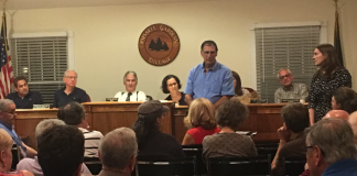 Representatives from Lockheed Martin address residents of Russell Gardens about concerns of a spreading groundwater plume. (Photo by Jessica Parks)