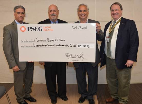 Sewanhaka board presented with PSEG check Sewanhaka board presented with PSEG check