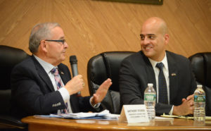 Anthony D'Urso and Byron Divins speak at Wednesday night's Meet the Candidates event. (Photo by Janelle Clausen)