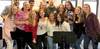 Fiona Lyngstad-Hughes and Maggie Roach were among the high school students selected to perform at the Broadway Back to School benefit in New York City on Sept. 23. The student participants are pictured here with Broadway actor Hunter Bell, in center, who served as emcee and co-producer for the event. (Photo courtesy of the Great Neck Public Schools)