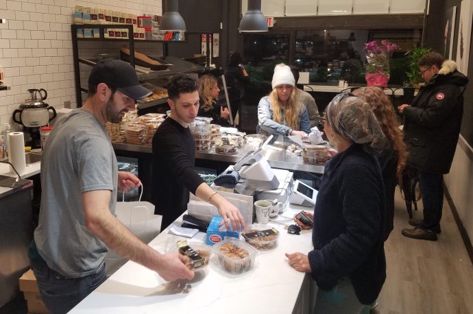 People lined up to get a taste of all sorts of pastries imported straight from Israel on Wednesday, the day after the restaurant's grand opening. (Photo by Janelle Clausen)