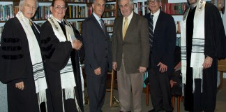 Arthur Flug posed for a photograph with religious and temple leaders before Temple Emanuel's Kristallnacht service. (Photo courtesy of Temple Emanuel)