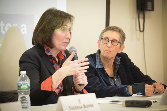 Madelyn Gould, a Columbia University psychiatry professor and Great Neck professor, speaks to attendees as Andi Katz, a mental health expert and member of North Shore Action, looks on. (Photo by Janelle Clausen)