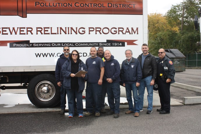 Great Neck Water Pollution Control District Commissioner Patty Katz, Commissioner Steve Reiter, and Superintendent Christopher Murphy stand with Nassau County Police Officer Jack Volpe and GNWPCD representatives at the recent Shed the Meds event. (Photo courtesy of the Great Neck Water Pollution Control District)