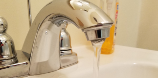 An employee runs water in the Blank Slate Media office. (Photo by Janelle Clausen)