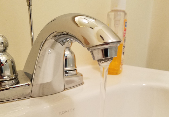 An employee runs water in the Blank Slate Media office. (Photo by Janelle Clausen)