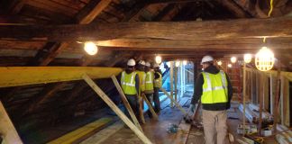 Workers stabilize the Roslyn Grist Mill's timber frame for its restoration. (Photo courtesy of the Roslyn Landmark Society)