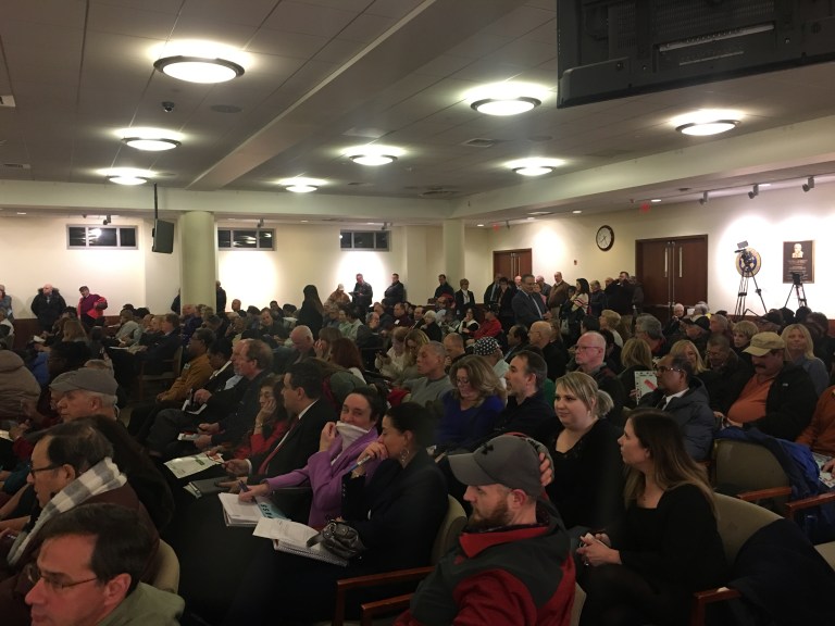 Taxpayers pile into Nassau County Legislature for reassessment hearing