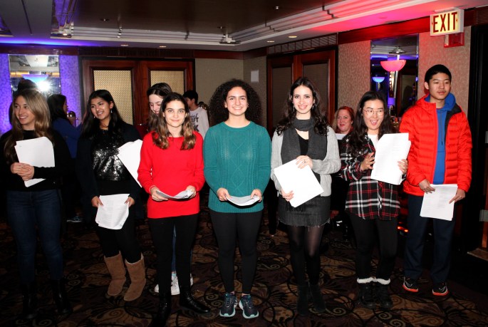 South High School's performers take a quick break for a photo at the Inn at Great Neck's annual tree lighting party. (Photo by Russell Lippai)
