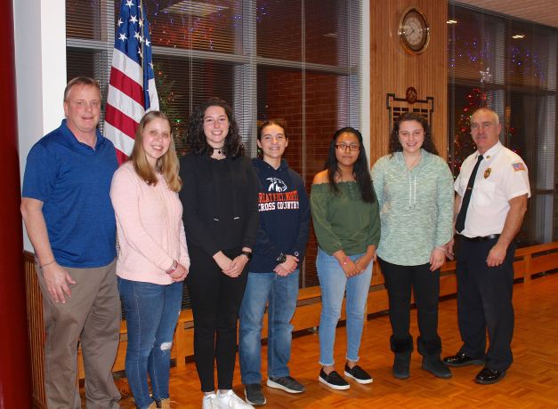 John Motchkavitz, Julia Motchkavitz, Maya Garfinkel, Lauren Murphy, Abigail Garcia, Alexandra Kessler, and Chief James Neubert. (Photo courtesy of Sara Rietbroek)
