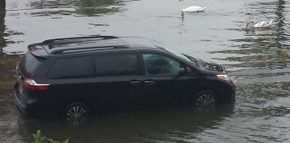 A van flooded when attempting to drive on Shore Road during a recent rainstorm. (Photo courtesy of Baxter Estates resident Maria Branco)