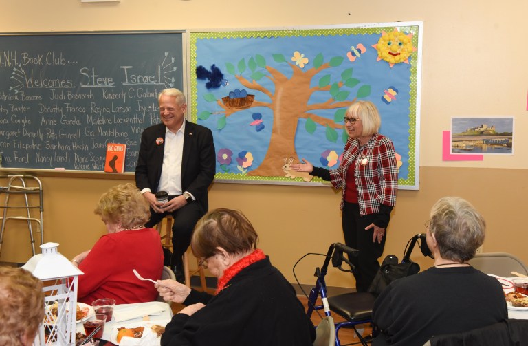 Former congressman Israel visits senior book club
