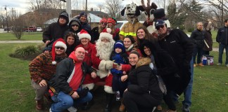 Santa Claus and members of the Plakstis family gather for a photo. (Photo by George Motchkavitz)