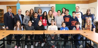 Representatives from the North Middle School Student Council are joined by Assemblyman Anthony D’Urso and Vietnam veteran Jack Hirsch; Principal Gerald Cozine and Assistant Principals Nancy Gunning and Jennifer Andersen; and Student Council Advisors Michelle Sicurella, Michael Noberto, Betty Brody, and Rachael Weissman. (Photo courtesy of the Great Neck Public Schools)