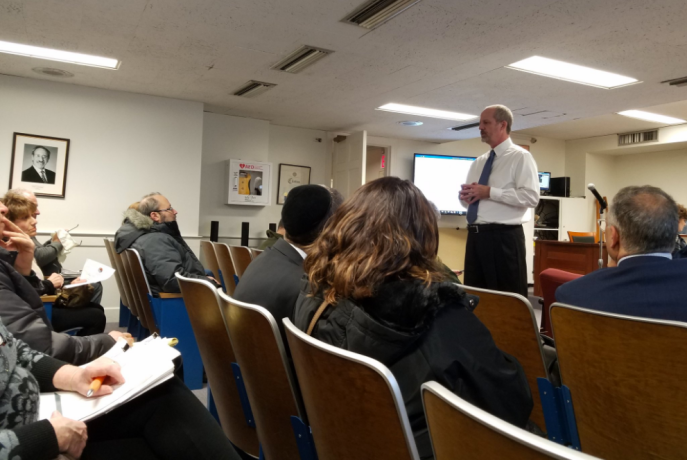 Village Clerk-Treasurer Joe Gill explains that the Jan. 15 meeting will be mostly housekeeping items regarding zoning amendments and other issues, not a presentation from VHB. (Photo by Janelle Clausen)