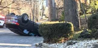 A car accident on Beach Road near Great Neck North High School left a vehicle overturned, but no serious injuries. (Photo courtesy of Ruth Gebay)