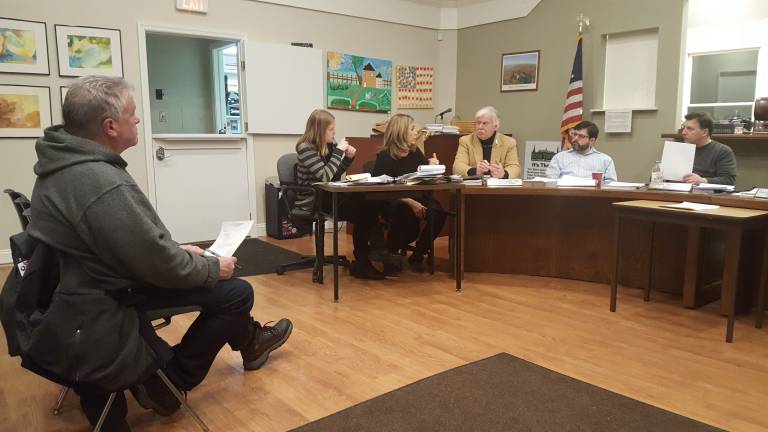 Roslyn Harbor passes screening requirements law