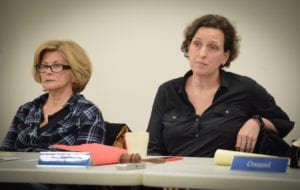 Great Neck Library Board President Rebecca Miller, pictured here with Trustee Josie Pizer, listens as residents air their concerns over the director's resignation. (Photo by Janelle Clausen)