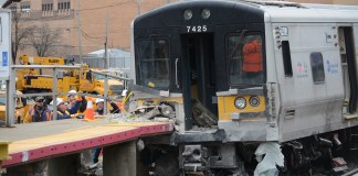 Three people were killed in a fatal crash before this LIRR train derailed and collided with the Westbury train station platform. (Photo by Janelle Clausen)