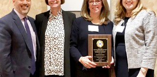 During the 2019 CAS Administrator of the Year awards ceremony, Parkville School Principal Kathleen Murray is congratulated by John F. Kennedy School Principal Ron Gimondo, Assistant Superintendent for Elementary Education Kelly Newman, and Superintendent of Schools Teresa Prendergast. (Photo courtesy of Great Neck Public Schools)