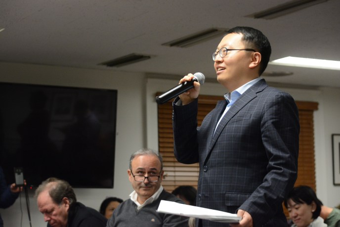 Te Bai, a Great Neck Plaza resident, speaks up at a Village of Great Neck meeting. (Photo by Janelle Clausen)