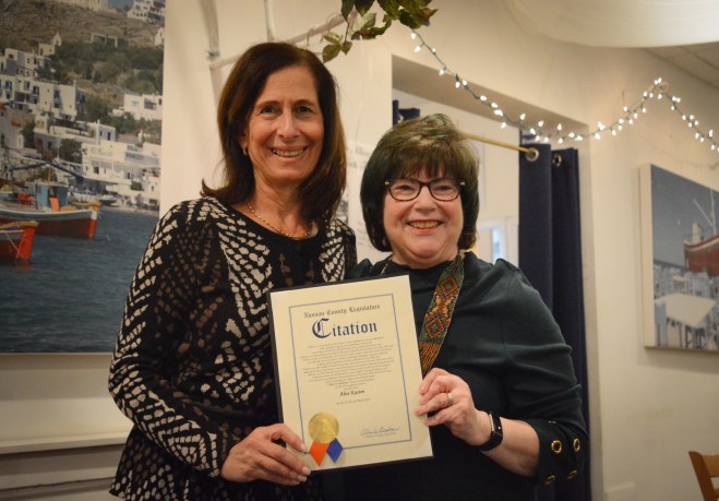Nassau County Legislator Ellen Birnbaum honors Kasten on behalf of the Nassau County Legislature. (Photo by Janelle Clausen)