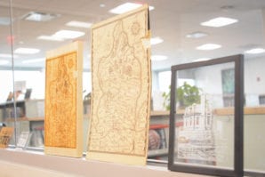 Using a combination of technologies and the laser engraver, library staff recreated old maps of Great Neck and a picture of the Stepping Stones Lighthouse. (Photo by Janelle Clausen)