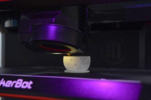 Hinz said a patron has been working on creating dice using the STEM lab's 3D printer. (Photo by Janelle Clausen)