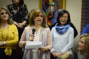 Mina Rabbani, who has taught art for more than 30 years, addresses the public and her students. (Photo by Janelle Clausen)