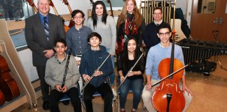 South High School musicians Eli Goldberger, Samuel Levine, Christiana Claus, Nicholas Langel, Benjamin T. Rossen, and Daniella Brancato are photographed with Principal Christopher Gitz, Janine Robinson, vocal music instructor, and Michael Schwartz, performing arts department chair. (Photo courtesy of the Great Neck Public Schools)