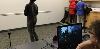 Teens trying out the virtual reality relaxation environment created by Team Dream at Levels. (Photo courtesy of the Great Neck Library)