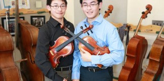 Mark Xu and Matthew Xu, both juniors at North High School, were selected to perform with the 2019 Honor Orchestra of America. (Photo courtesy of the Great Neck Public Schools)