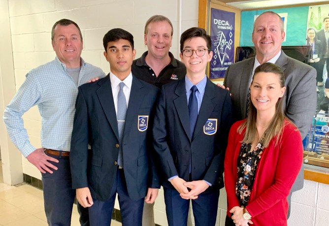 Photographed left to right: Rick Vine, South High DECA advisor/business teacher; junior Amal Deochand, head of the school store; John Motchkavitz, South High business department head; junior Ian Tsao, manager of the school store; Christopher Gitz, South High School principal; and Sheryl Demetres, South High DECA advisor/business teacher. (Photo courtesy of the Great Neck Public Schools)