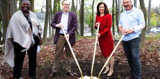 Myrnissa A. Stone-Sumair, the executive director of Habitat for Humanity in Nassau County, Tod Johnson, executive chairman of The NPD Group, Nassau County Legislator Ellen Birnbaum, and Peter Hayes, board treasurer of Habitat for Humanity in Nassau County, break ground on a home NPD will be the main corporate sponsor of in Great Neck. (Photo courtesy of The NPD Group)