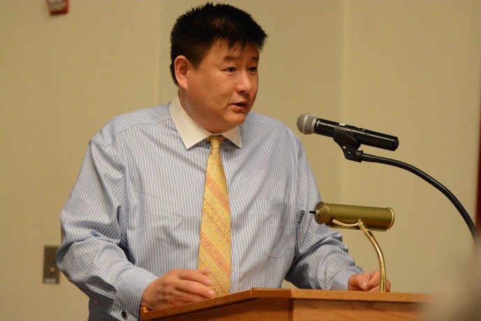 James Wu, who is challenging Mayor Pedram Bral, faced questions over campaign finance violations related to a race in Queens at a campaign forum Tuesday night. (Photo by Janelle Clausen)