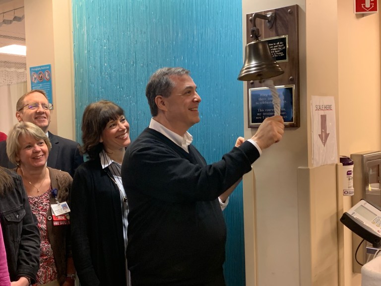 Peter Forman signifies end of his battle with cancer with three rings of a bell at NYU Winthrop