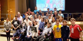 Representatives from the Viscardi School are photographed here with JFK Assistant Principal Michelle Bell, fifth-grade teacher Rebecca Schapira, and fourth and fifth-grade members of the JFK Student Council. (Photo courtesy of Great Neck Public Schools)