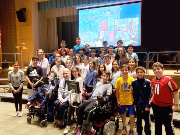 Representatives from the Viscardi School are photographed here with JFK Assistant Principal Michelle Bell, fifth-grade teacher Rebecca Schapira, and fourth and fifth-grade members of the JFK Student Council. (Photo courtesy of Great Neck Public Schools)