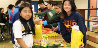 South Middle sixth graders assemble chemo care kits for pediatric cancer patients through the charity Golden Heroes. (Photo courtesy of Great Neck Public Schools)