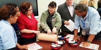 A representative from the Nassau County Fire-Police EMS Academy demonstrates life-saving bleeding control strategies during a recent training workshop as part of the Stop the Bleed initiative. (Photo courtesy of Great Neck Public Schools)