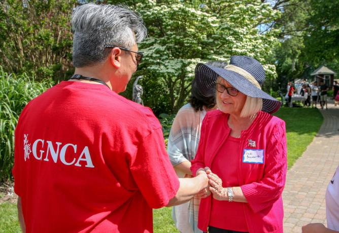 Supervisor Judi Bosworth speaks with a member of the Great Neck Chinese Association on June 9 at an annual picnic where John Motchkavtiz, Kingsley Liu and Li Chang were honored for their dedication the GNCA. (Photo courtesy of Town of North Hempstead)