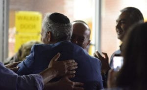 Mayor Pedram Bral, victorious in his election, was greeted by an enthusiastic crowd outside the polling place at E.M. Baker Elementary School. Some people asked for photos. (Photo by Janelle Clausen)