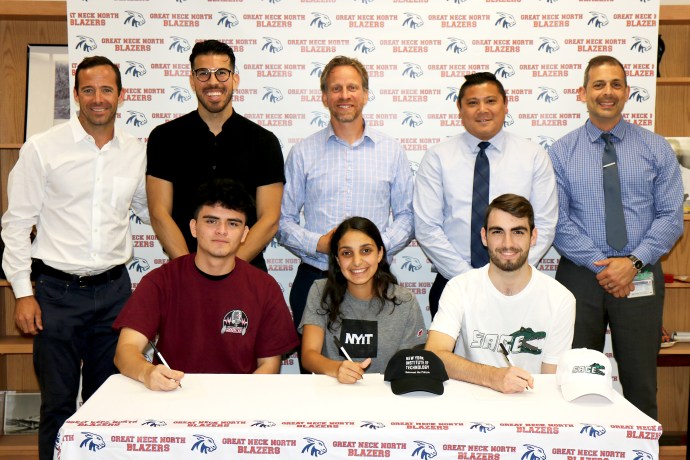 North High Athletic Director Eamonn Flood, boys soccer head coach Anton Berzins, girls cross country and track head coach Joseph Bonvicino, boys lacrosse assistant coach Even Chen, and North High Principal Daniel Holtzman congratulate athletes William Rivera Zavala, Alexis Namdar, and James Neubert during a ceremony on June 11. (Photo courtesy of Great Neck Public Schools)